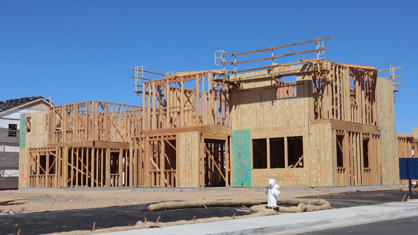 New home under construction with wood framing complete