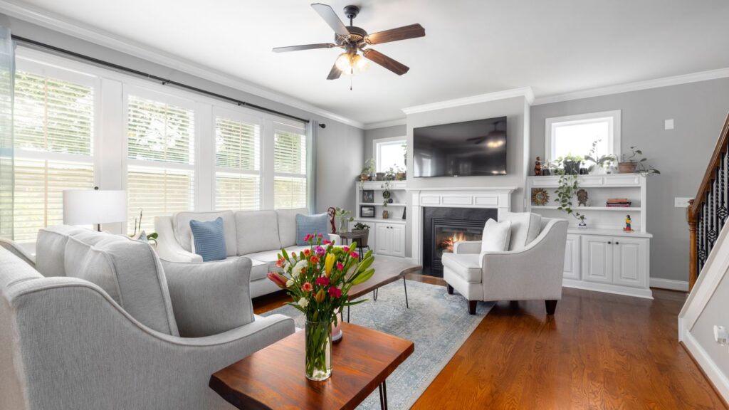 Bright and stylish living room with fireplace and elegant furniture.