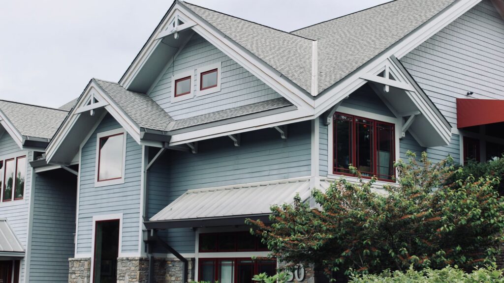 Charming blue house exterior with modern architectural features in Asheville, NC.