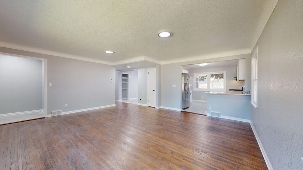 Open and bright living room with hardwood floors and natural light.